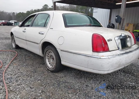 1999 Lincoln Town Car Executive из США, поврежденный, VIN 1LNHM81WXXY680876
